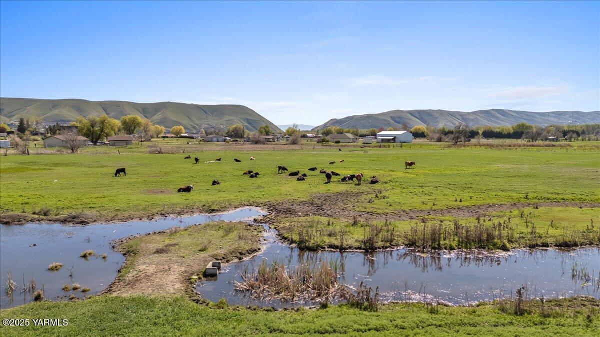 Nka Birchfield Road West, Unit LOT # 1C Yakima, WA 98901 - Photo 4 of 8 a view of a lake with a city