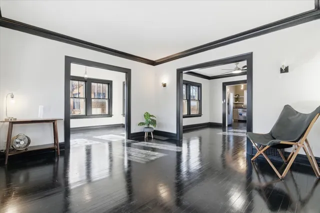 a view of a livingroom with furniture and hardwood floor