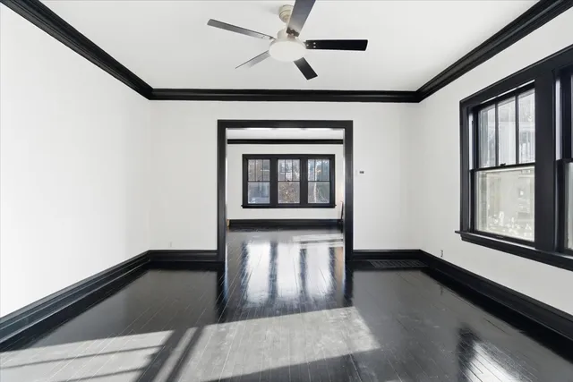 a living room with a bed furniture and a window