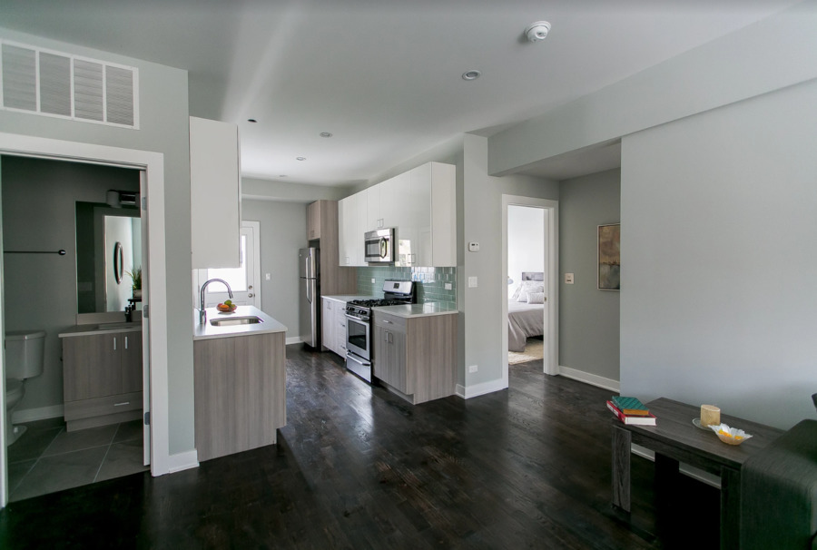 Undisclosed Address Chicago, IL 60613 - Photo 2 of 4 a view of kitchen and dining room with wooden floor