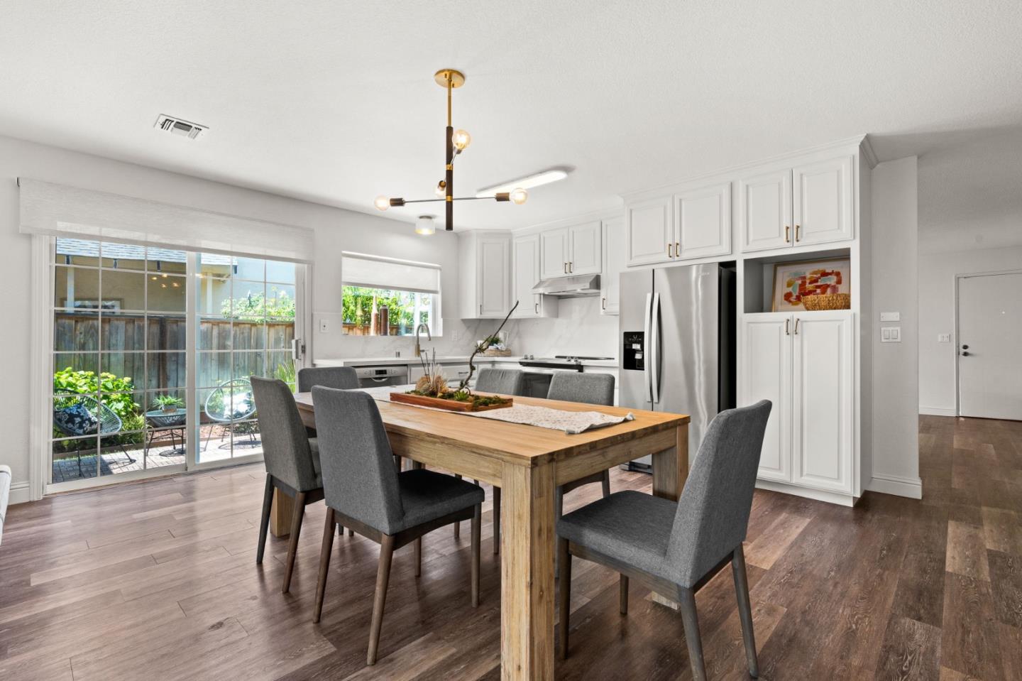 282 Coty Way San Jose, CA 95136 - Photo 13 of 69 a view of a dining room with furniture window and wooden floor
