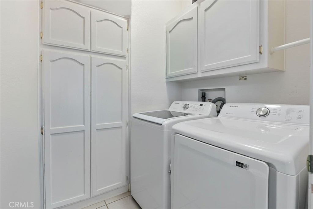 7271 Katella Avenue, Unit 101 Stanton, CA 90680 - Photo 11 of 34 a utility room with dryer and washer