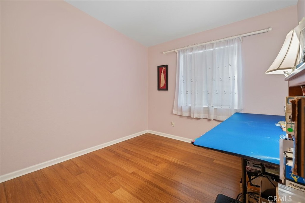 7271 Katella Avenue, Unit 101 Stanton, CA 90680 - Photo 13 of 34 a room with a bed and a table