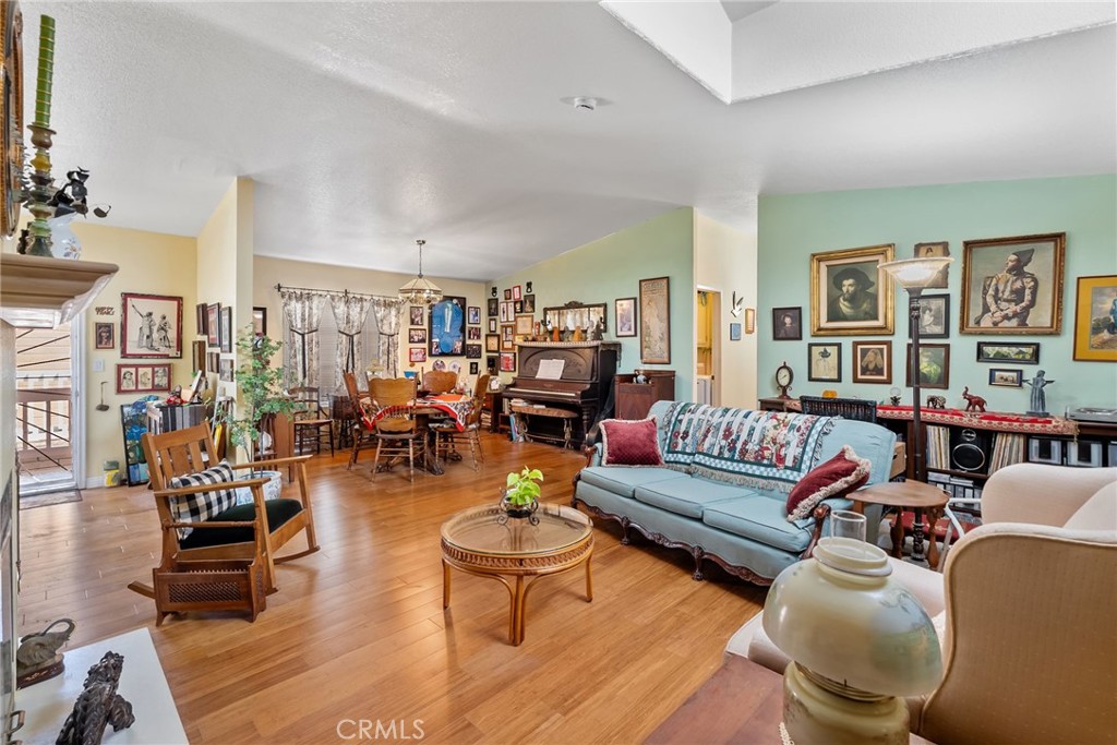 7271 Katella Avenue, Unit 101 Stanton, CA 90680 - Photo 15 of 34 a living room with furniture and wooden floor