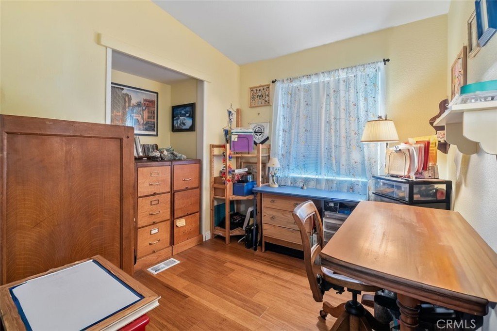 7271 Katella Avenue, Unit 101 Stanton, CA 90680 - Photo 16 of 34 a room with furniture and wooden floor