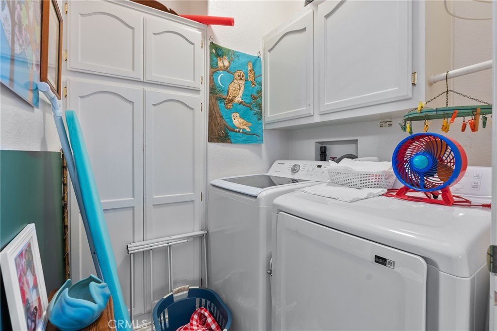 7271 Katella Avenue, Unit 101 Stanton, CA 90680 - Photo 18 of 34 a utility room with dryer and washer