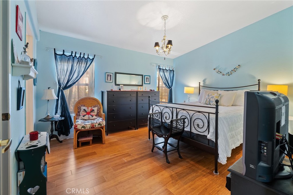 7271 Katella Avenue, Unit 101 Stanton, CA 90680 - Photo 3 of 34 a view of a room with furniture and wooden floor