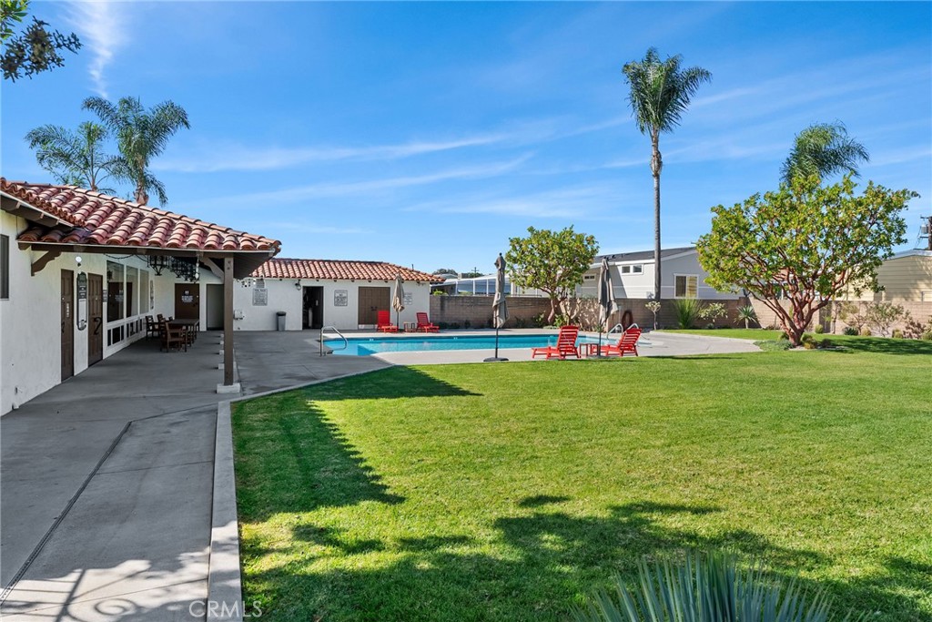 7271 Katella Avenue, Unit 101 Stanton, CA 90680 - Photo 32 of 34 a front view of a house with garden