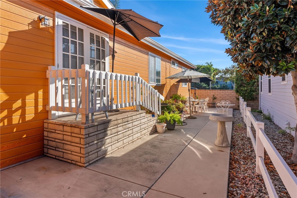 7271 Katella Avenue, Unit 101 Stanton, CA 90680 - Photo 4 of 34 a view of a patio with a table and chairs