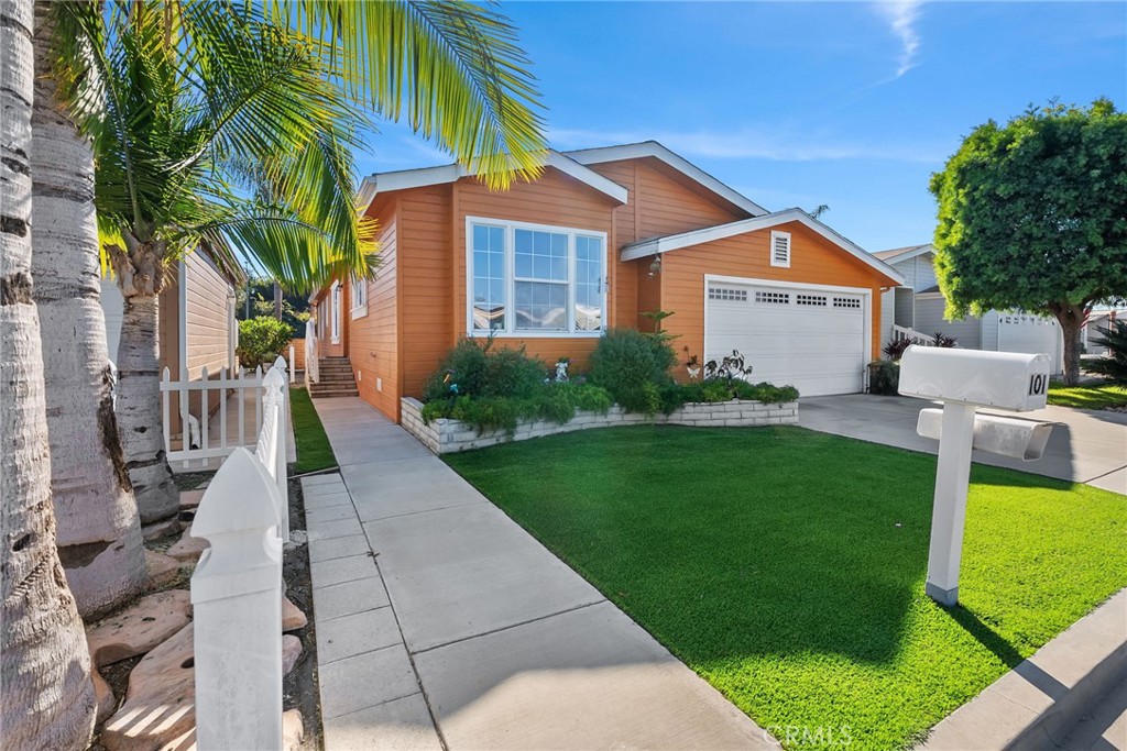 7271 Katella Avenue, Unit 101 Stanton, CA 90680 - Photo 5 of 34 a front view of house with yard and green space