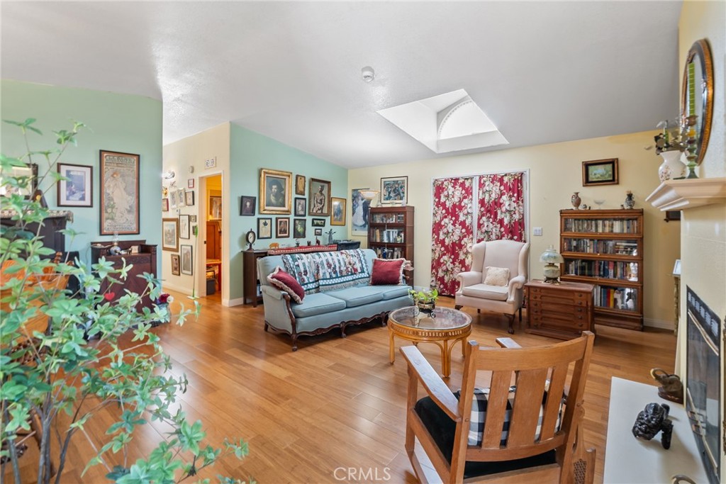 7271 Katella Avenue, Unit 101 Stanton, CA 90680 - Photo 6 of 34 a living room with furniture and a flat screen tv