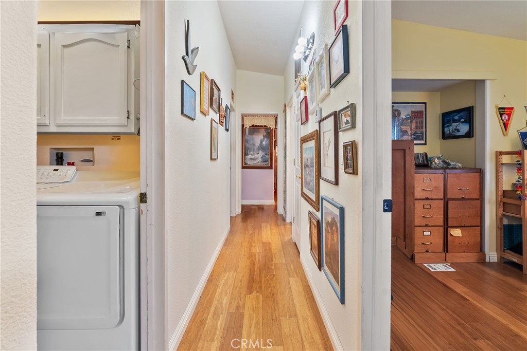 7271 Katella Avenue, Unit 101 Stanton, CA 90680 - Photo 10 of 34 a view of a kitchen from the hallway