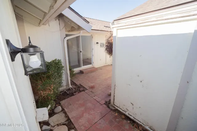 a view of a house with backyard and a garden