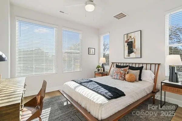 a bedroom with a bed and chair