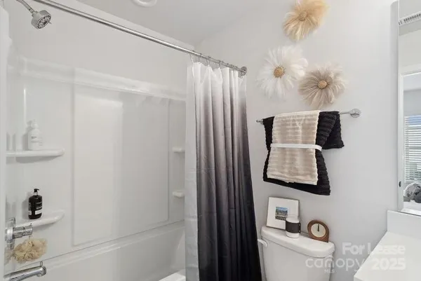 a bathroom with a bathtub and shower