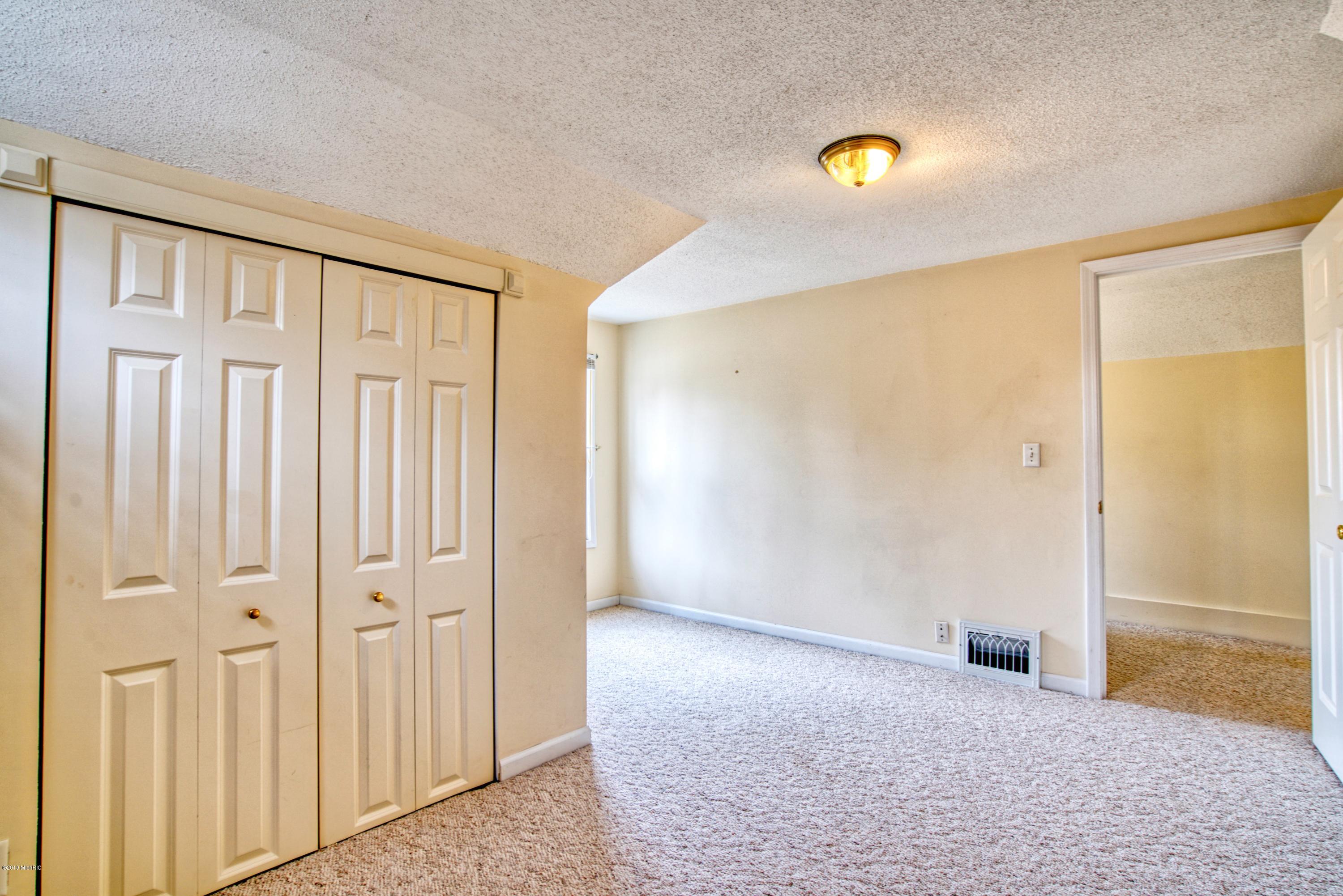 1515 Sheldon Road Grand Haven, MI 49417 - Photo 26 of 32 27. Bedroom 3 Reverse Angle