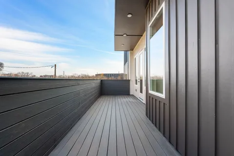 a kitchen with stainless steel appliances granite countertop a refrigerator a stove and a sink