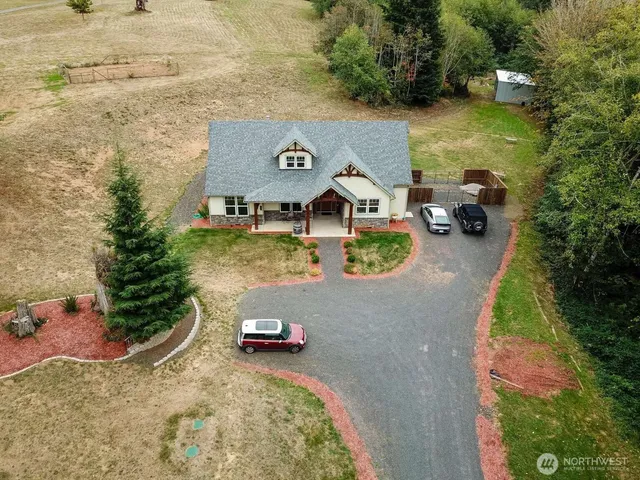 an aerial view of a house with outdoor space