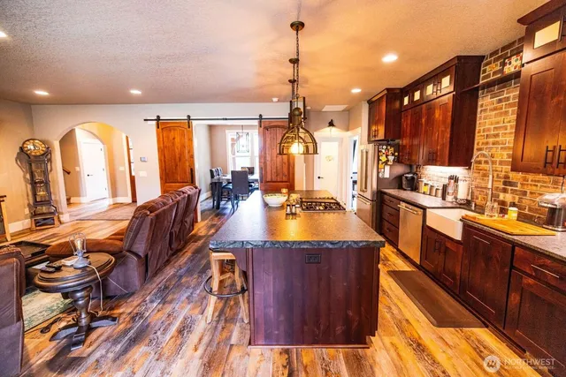 a large kitchen with lots of counter space and a large window