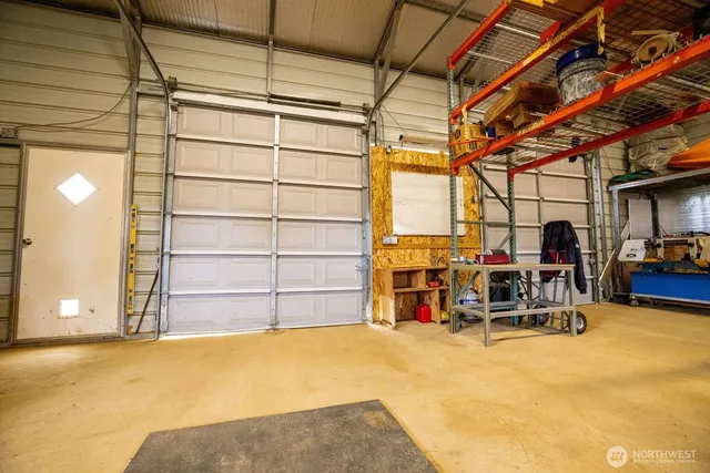 a view of a room with furniture and a garage