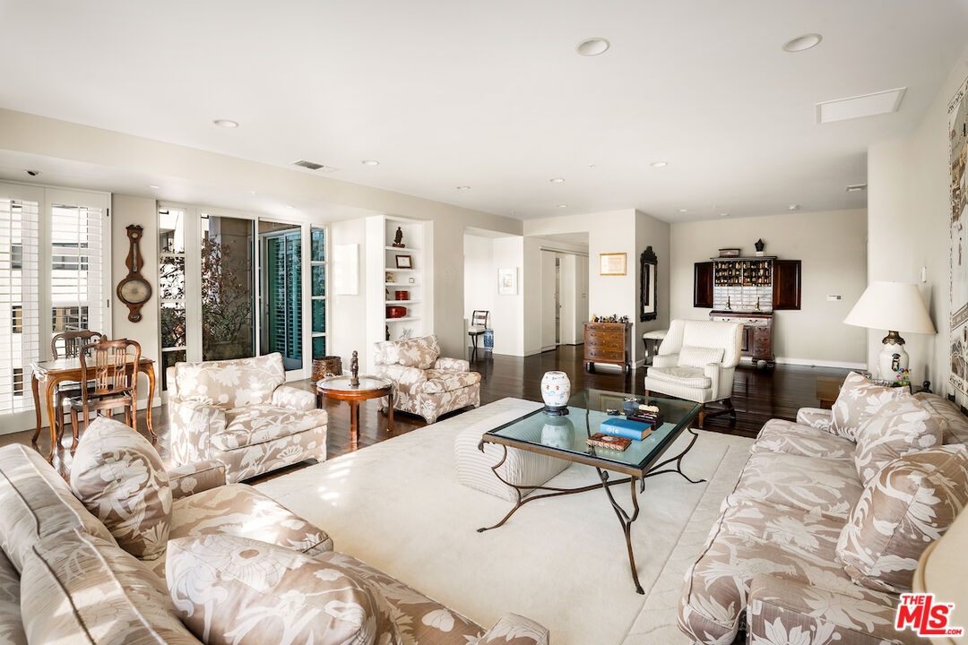 10580 Wilshire Boulevard, Unit 45 Los Angeles, CA 90024 - Photo 11 of 35 a living room with furniture and large windows