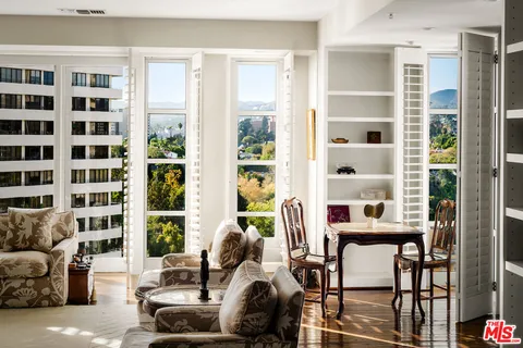a living room with furniture and windows