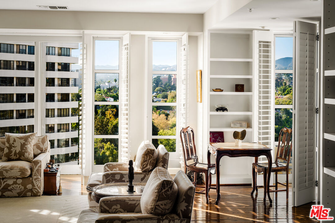10580 Wilshire Boulevard, Unit 45 Los Angeles, CA 90024 - Photo 12 of 35 a living room with furniture and windows