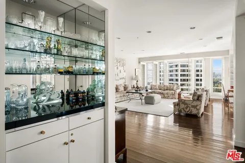a view of living room and dining room with wooden floor