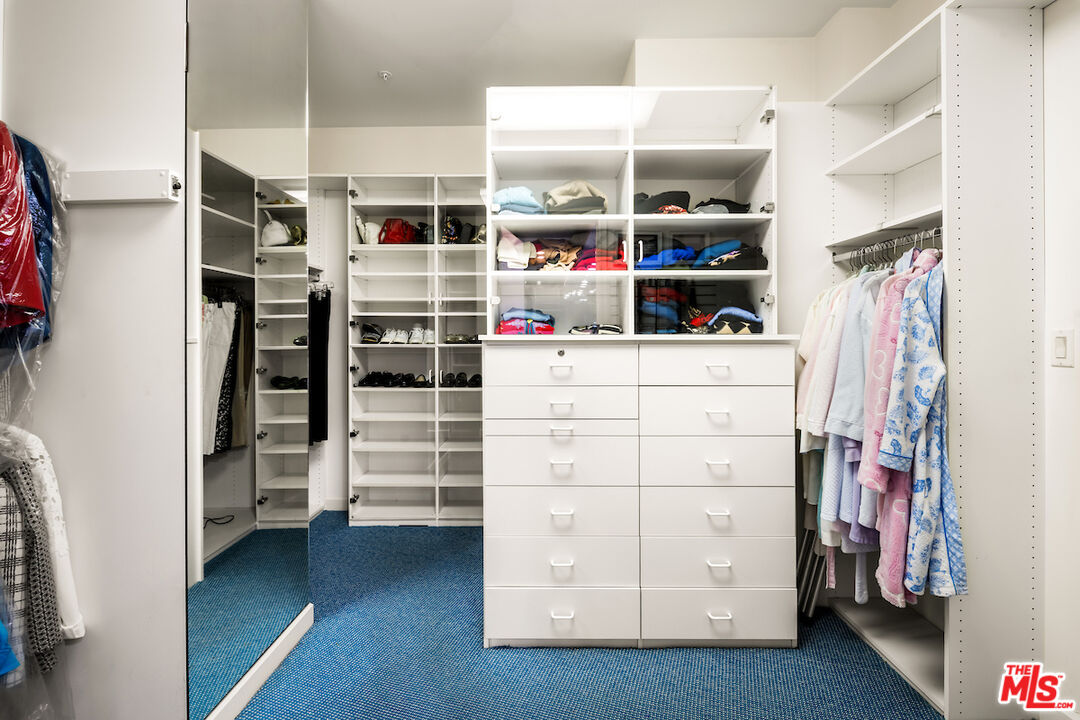 10580 Wilshire Boulevard, Unit 45 Los Angeles, CA 90024 - Photo 26 of 35 a view of walk in closet with clothes and shoes