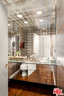 a room with granite countertop a sink and cabinets