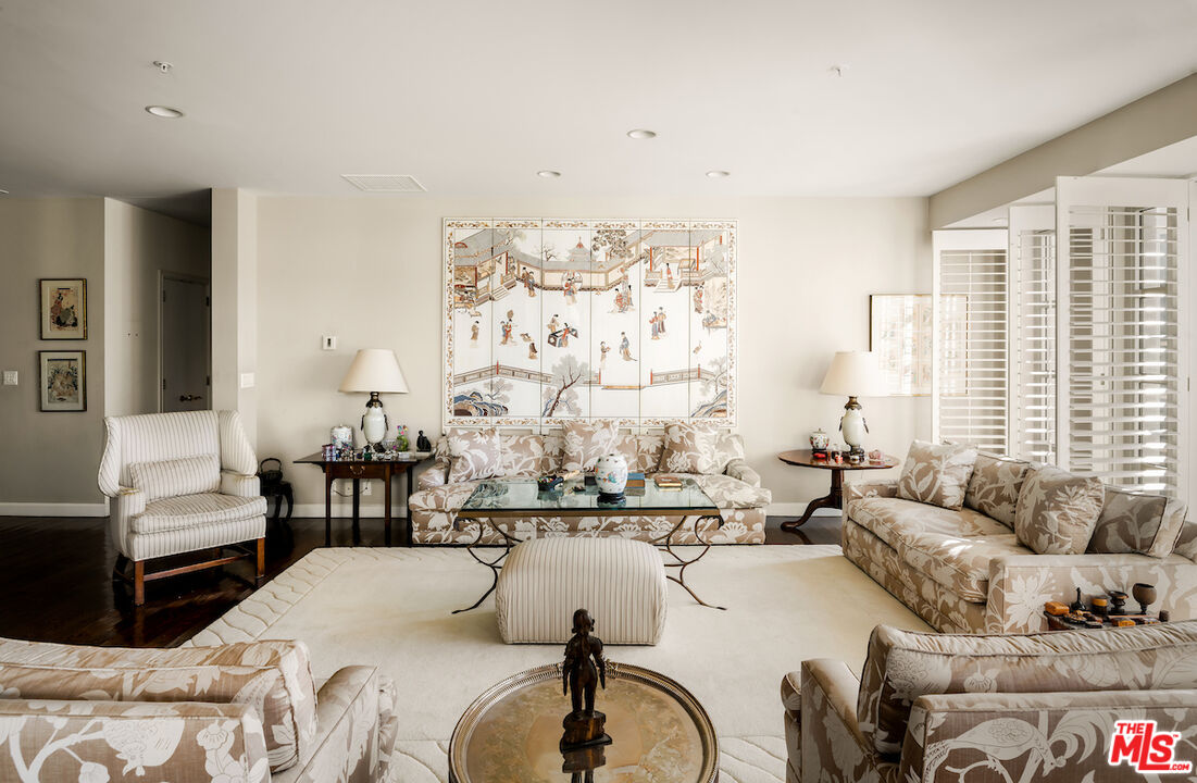 10580 Wilshire Boulevard, Unit 45 Los Angeles, CA 90024 - Photo 7 of 35 a living room with furniture and a large window