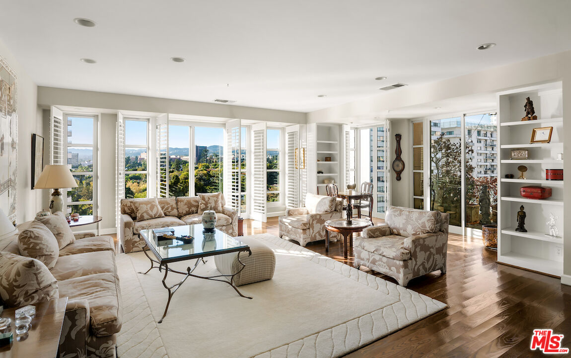10580 Wilshire Boulevard, Unit 45 Los Angeles, CA 90024 - Photo 8 of 35 a living room with furniture and a large window
