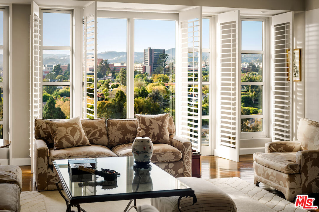 10580 Wilshire Boulevard, Unit 45 Los Angeles, CA 90024 - Photo 9 of 35 a living room with furniture and a large window