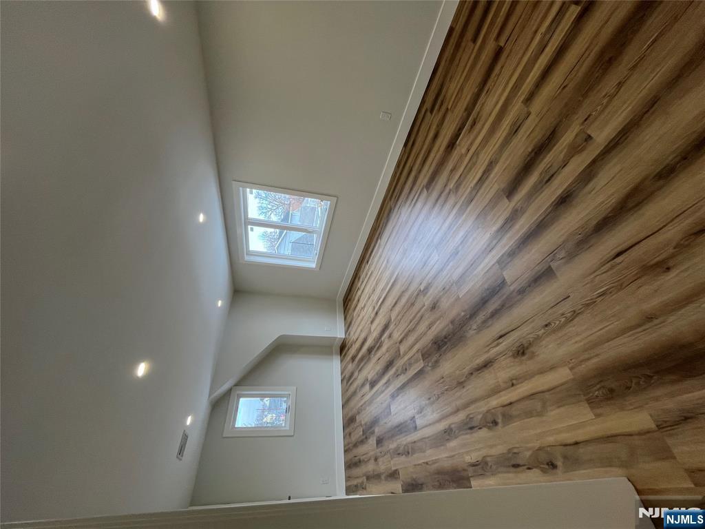 17 Market Street, Unit 2 Garfield, NJ 07026 - Photo 2 of 16 wooden floor in an empty room with a window