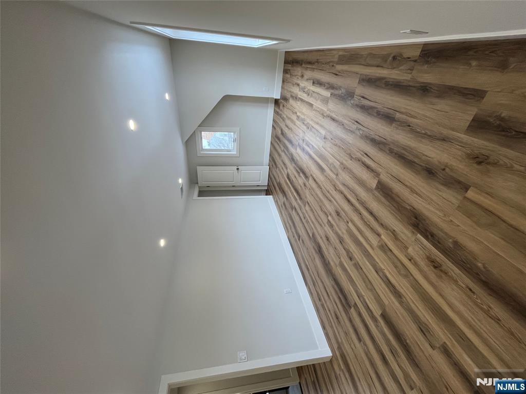 17 Market Street, Unit 2 Garfield, NJ 07026 - Photo 3 of 16 a view of an empty room and wooden floor