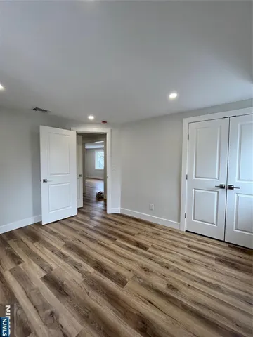 a view of a livingroom with wooden floor