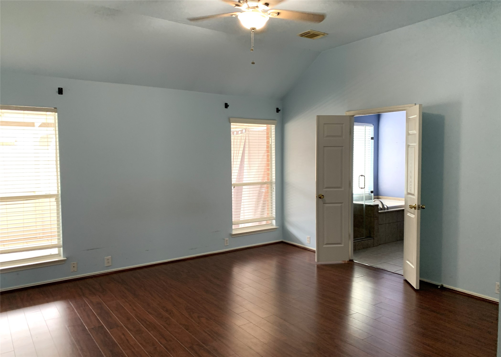 11014 Redhaven Court Houston, TX 77065 - Photo 11 of 20 an empty room with wooden floor and windows