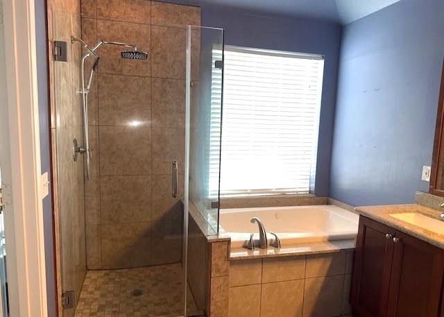 11014 Redhaven Court Houston, TX 77065 - Photo 14 of 20 a bathroom with a granite countertop sink and a bathtub