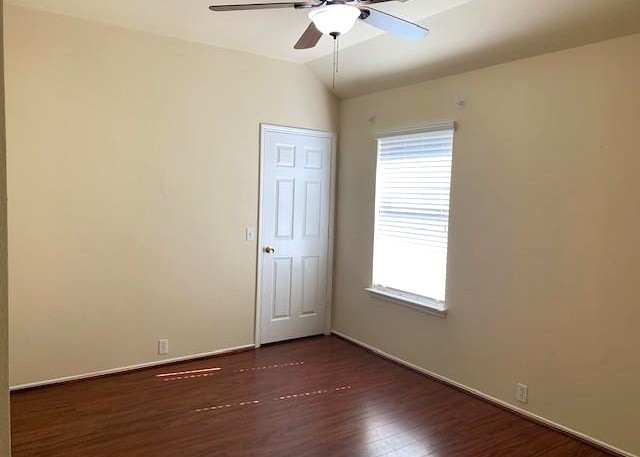 11014 Redhaven Court Houston, TX 77065 - Photo 15 of 20 an empty room with a window and wooden floor