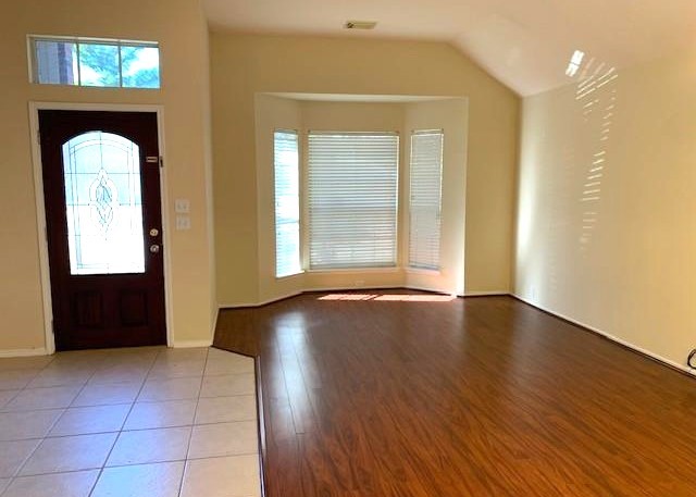 11014 Redhaven Court Houston, TX 77065 - Photo 4 of 20 an empty room with wooden floor and windows