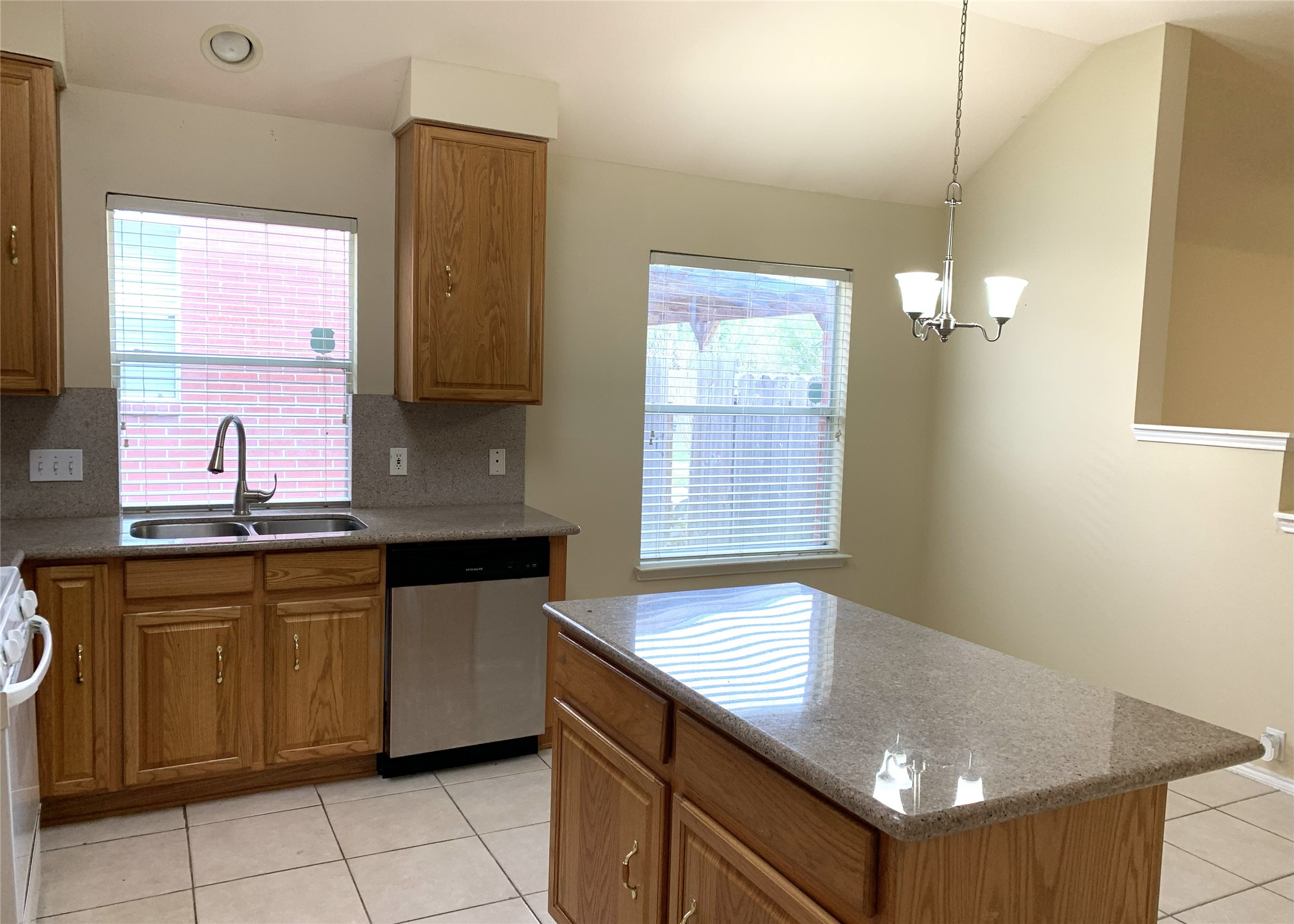 11014 Redhaven Court Houston, TX 77065 - Photo 9 of 20 a kitchen that has a sink and a stove in it