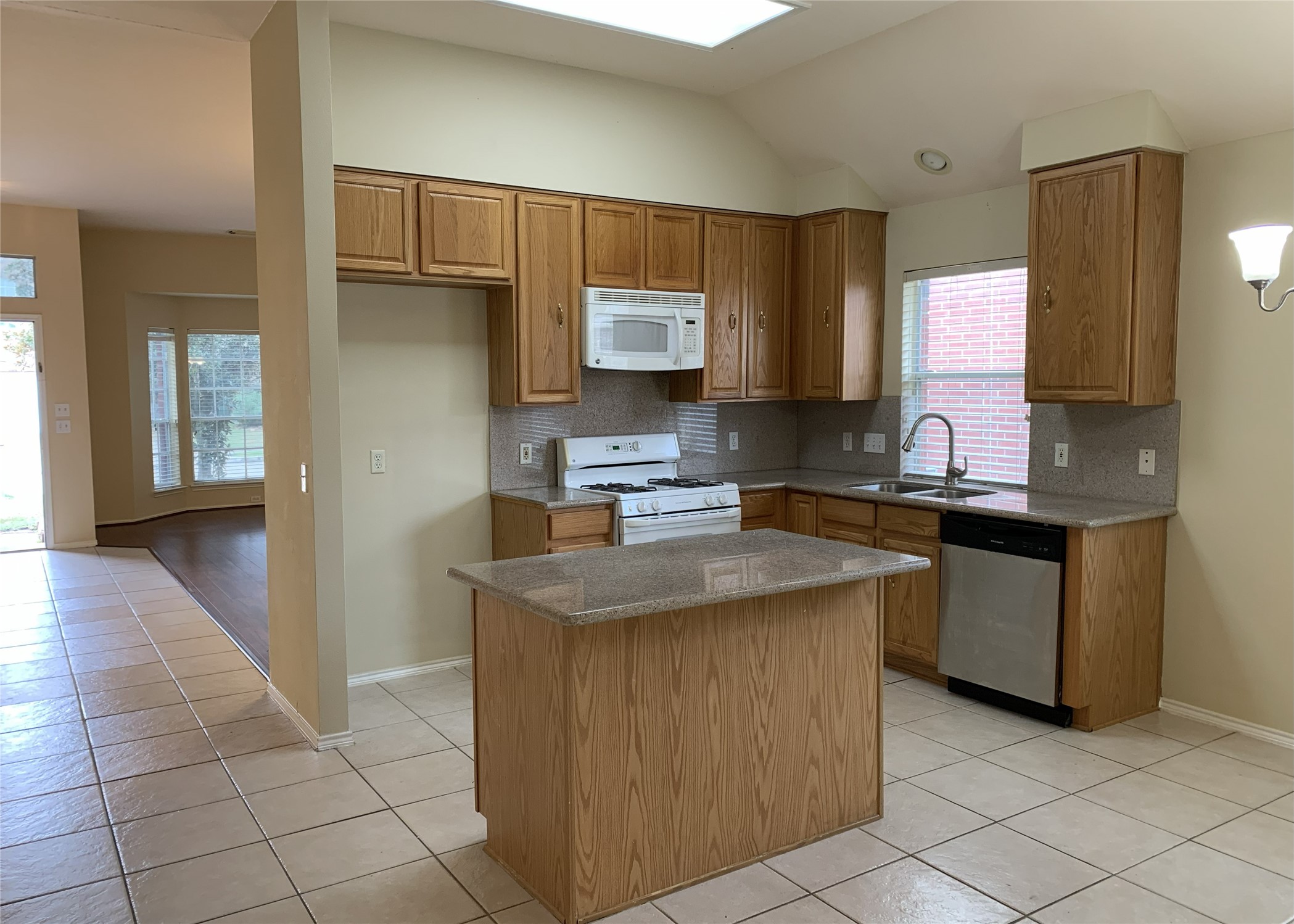 11014 Redhaven Court Houston, TX 77065 - Photo 10 of 20 a kitchen with stainless steel appliances granite countertop a sink stove and refrigerator