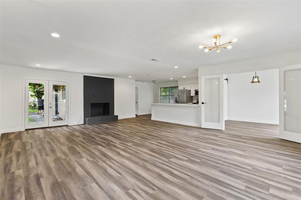 3126 Jubilee Trail Dallas, TX 75229 - Photo 3 of 38 a view of a kitchen with wooden floor and a kitchen space