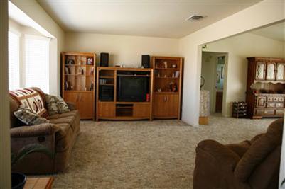17136 La Canada Road Madera, CA 93636 - Photo 3 of 14 A very spacious living area is great for family and entertaining. The isolated 4th bedroom and third bathroom are through the doorway visible in the back right of the photograph.