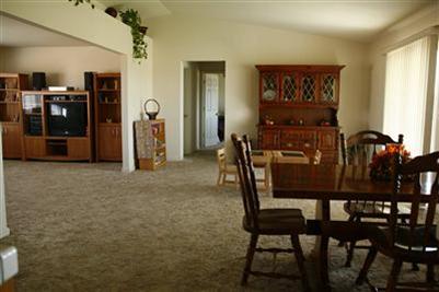 17136 La Canada Road Madera, CA 93636 - Photo 4 of 14 The dining area and another large living area.