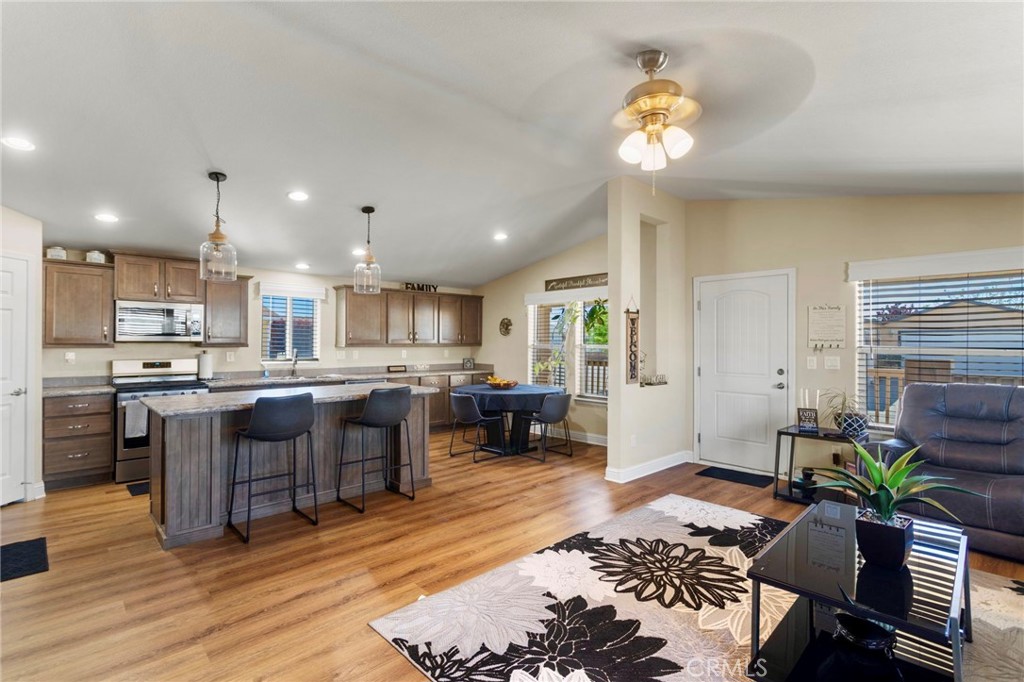 Open kitchen with large island flowing into living room.