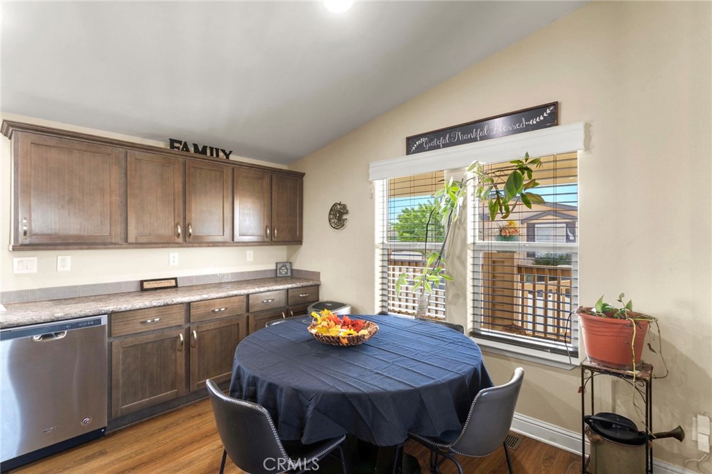 22241 Nisqually Road, Unit 103 Apple Valley, CA 92308 - Photo 11 of 34 Dining area with natural light and window views