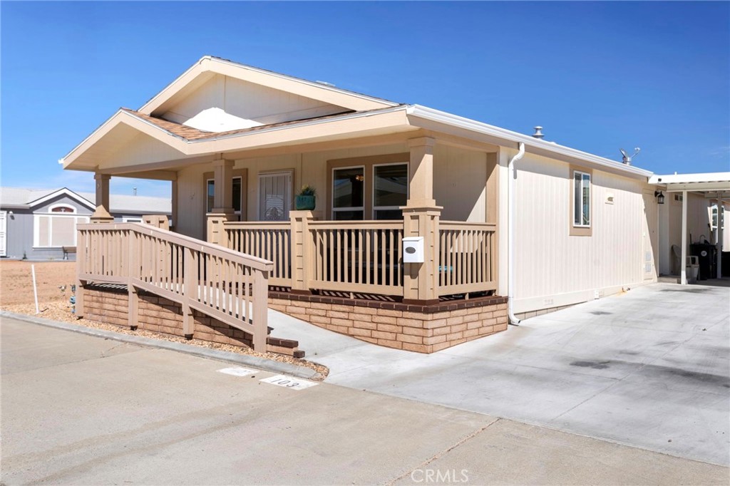 22241 Nisqually Road, Unit 103 Apple Valley, CA 92308 - Photo 2 of 34 Charming exterior with front porch. Ramp
