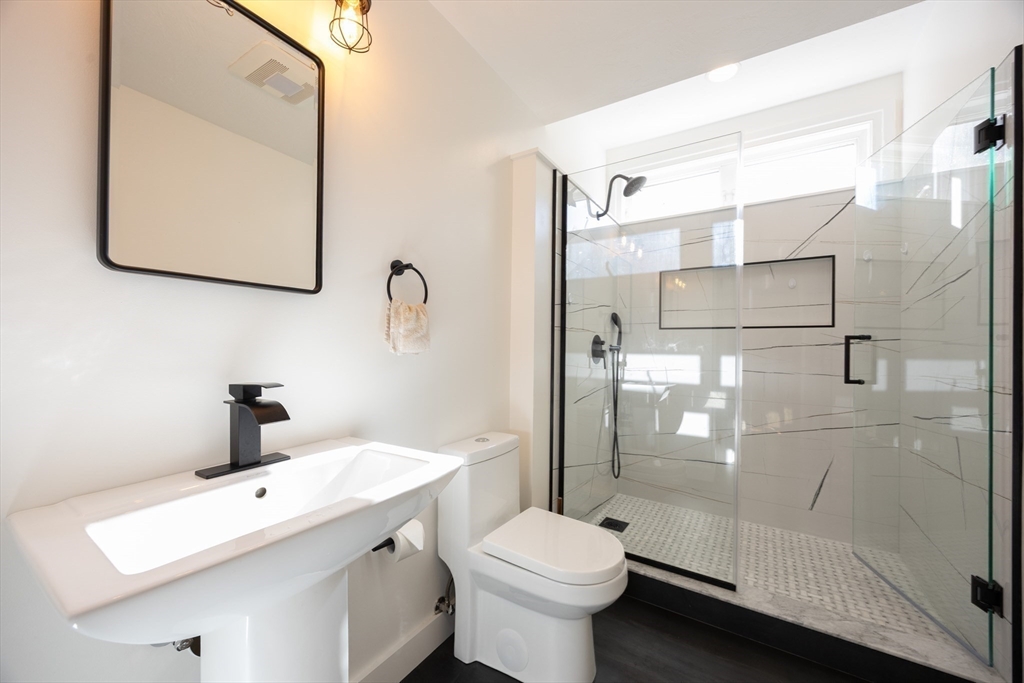 27 Fowler Street Upton, MA 01568 - Photo 14 of 36 a bathroom with a sink toilet and shower