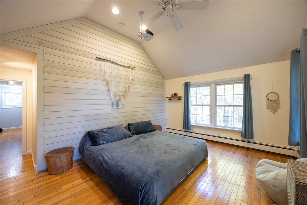 27 Fowler Street Upton, MA 01568 - Photo 18 of 36 a spacious bedroom with a bed and wooden floor